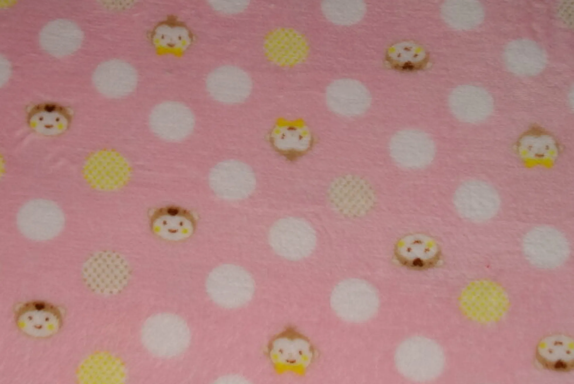 Coral Fleece – Monkey dots on pink