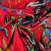 Fluweel stretch – Tropical leaves on red crushed look