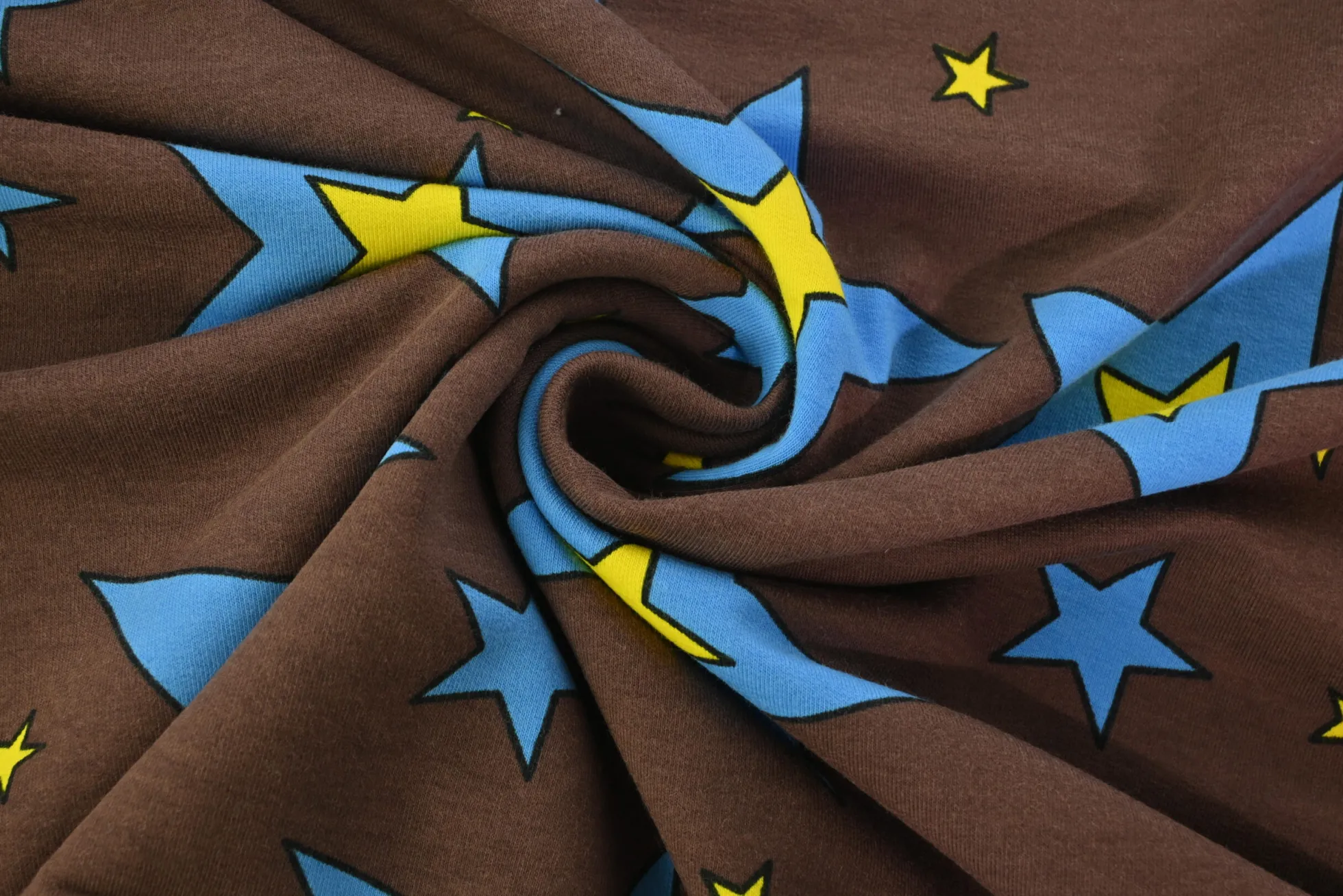 French terry – Cartoon stars on brown