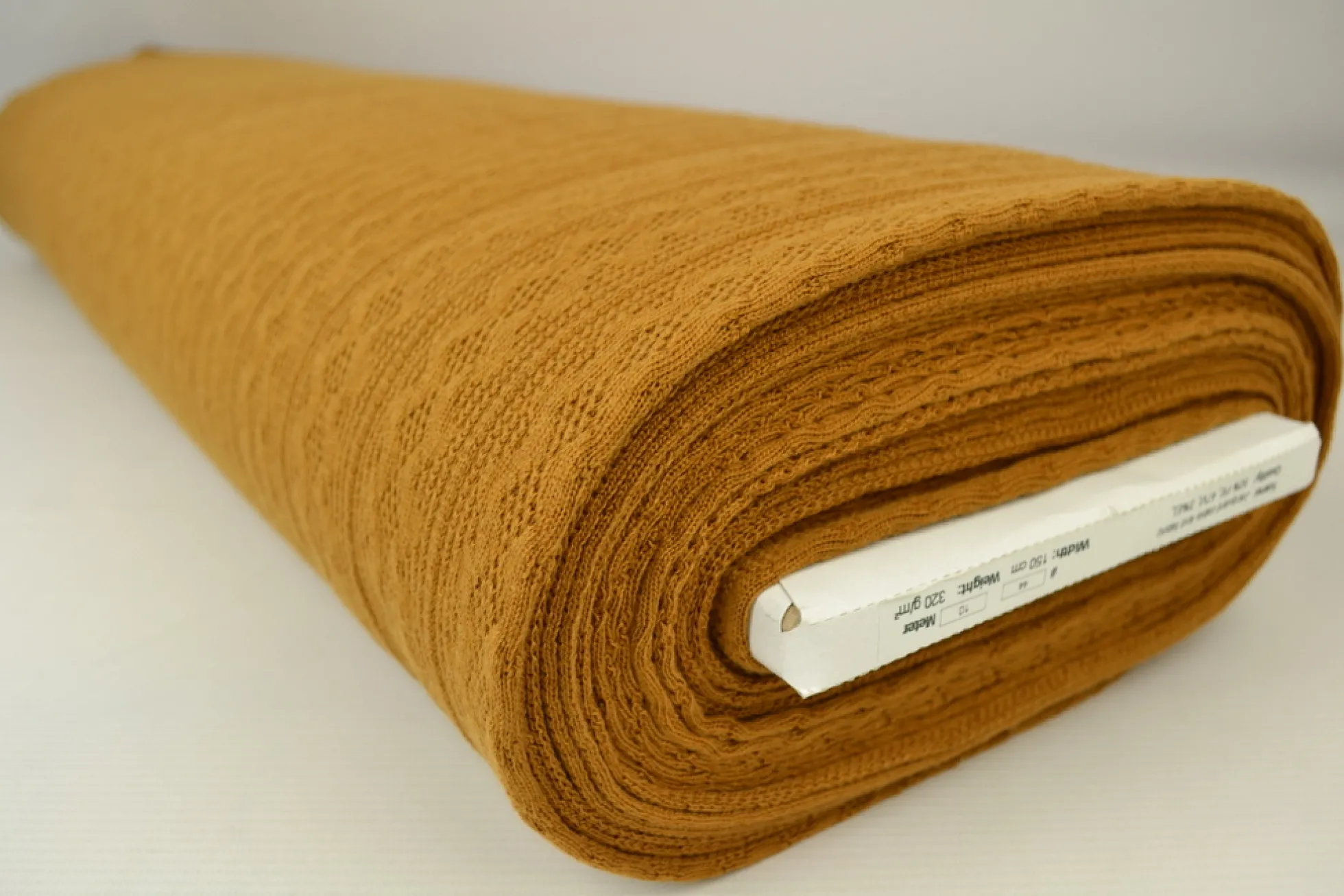Jacquard jersey kabel – Donker oker