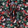 Katoen poplin – Kleurrijke bloemenbos groen en rood op zwart