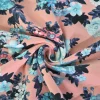 Katoen tricot – Blue and coral flowers on salmon