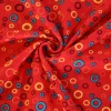 Katoen tricot – Colorful circles on red