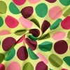 Katoen tricot – Colorful dots on bright yellow