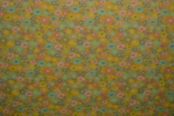 Katoen tricot – Wow – Kleine bloemetjes okergeel