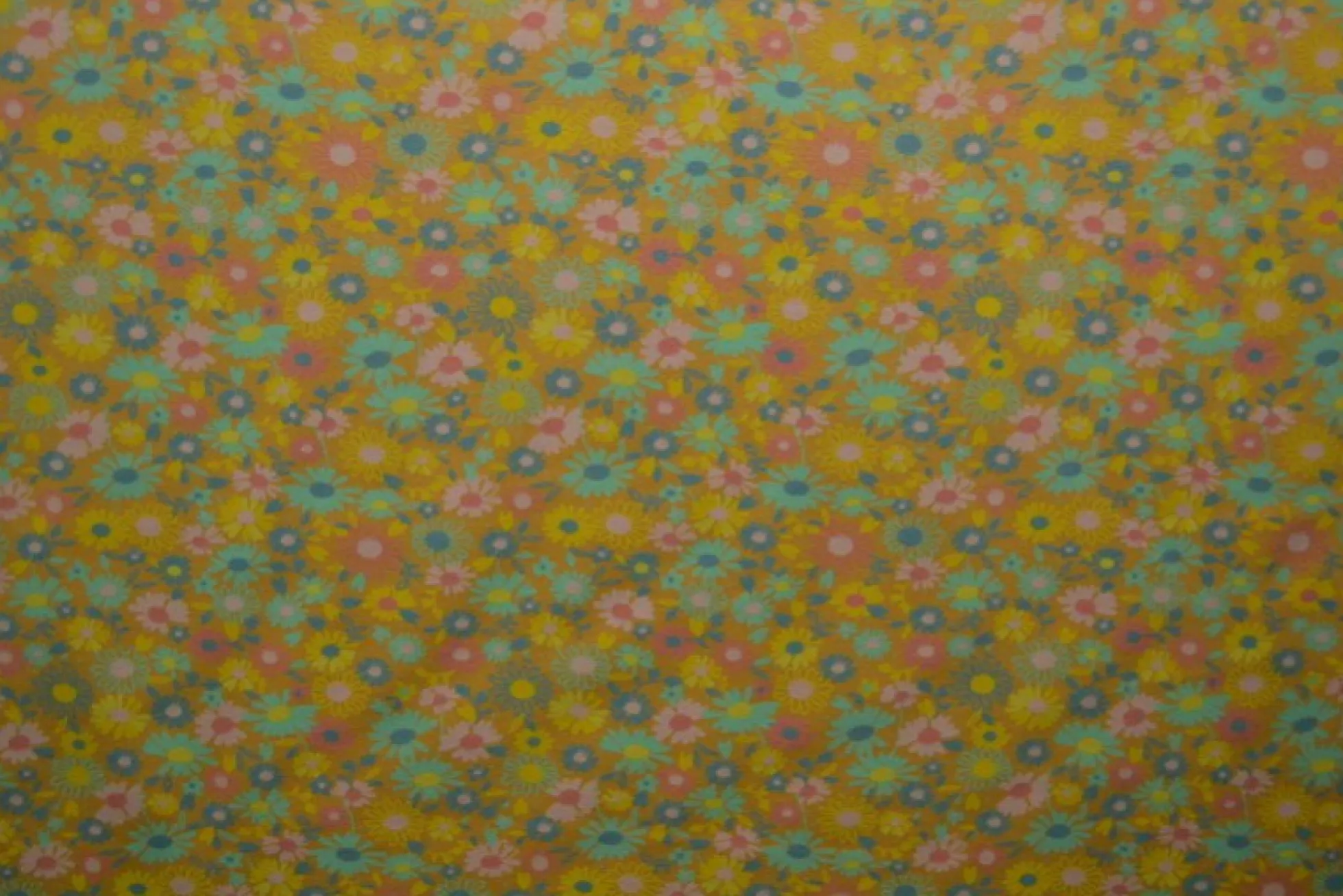 Katoen tricot – Wow – Kleine bloemetjes okergeel