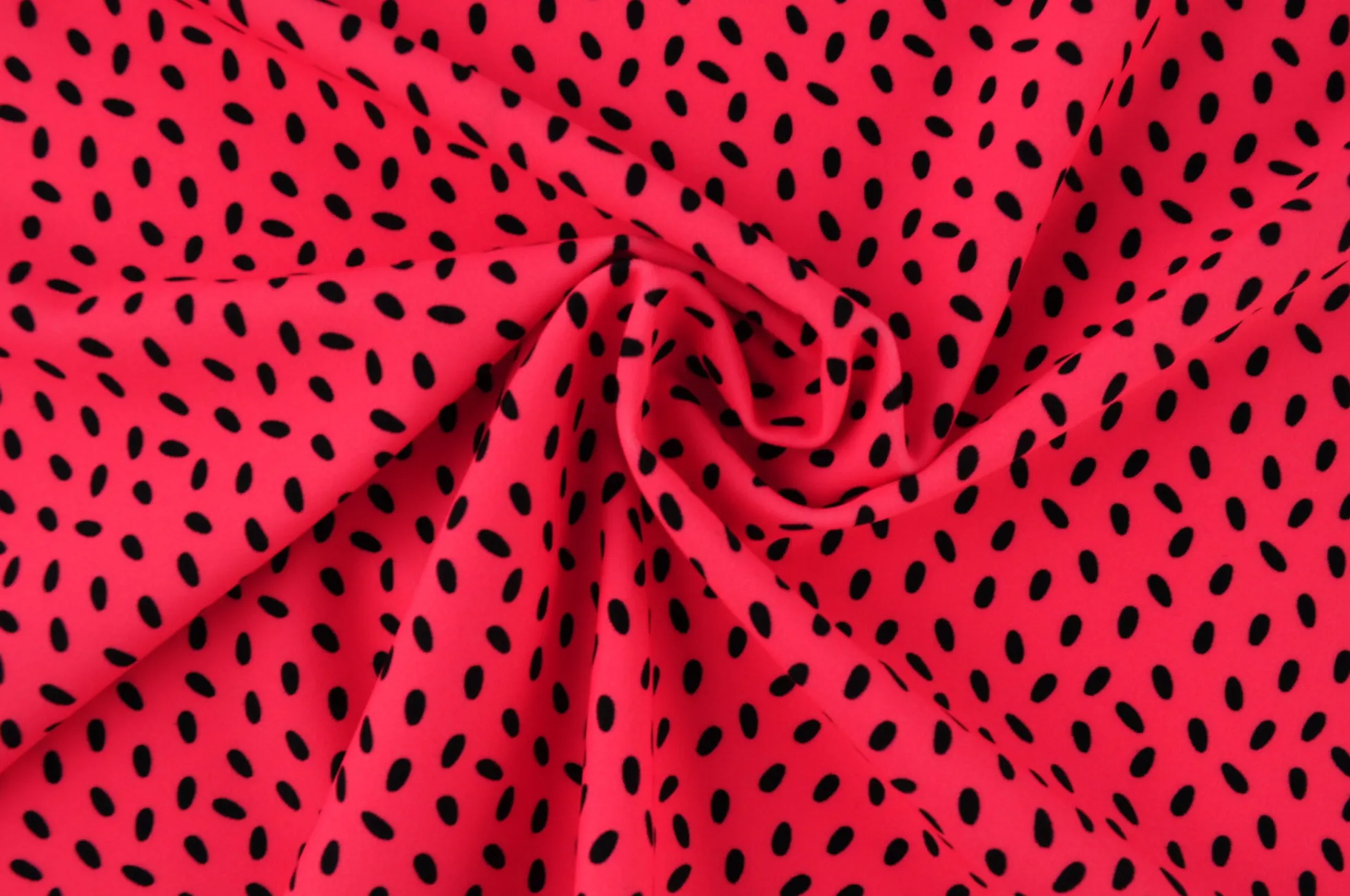 Lycra – Black dots on coral pink