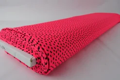 Lycra – Black dots on coral pink