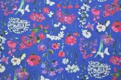 Stretch katoen – Poppy on blue denim