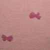 Teddy badstof – Roze strikjes