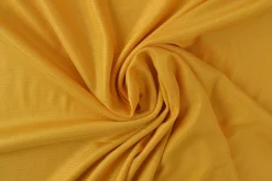 Tricot voering / Charmeuse: Okergeel