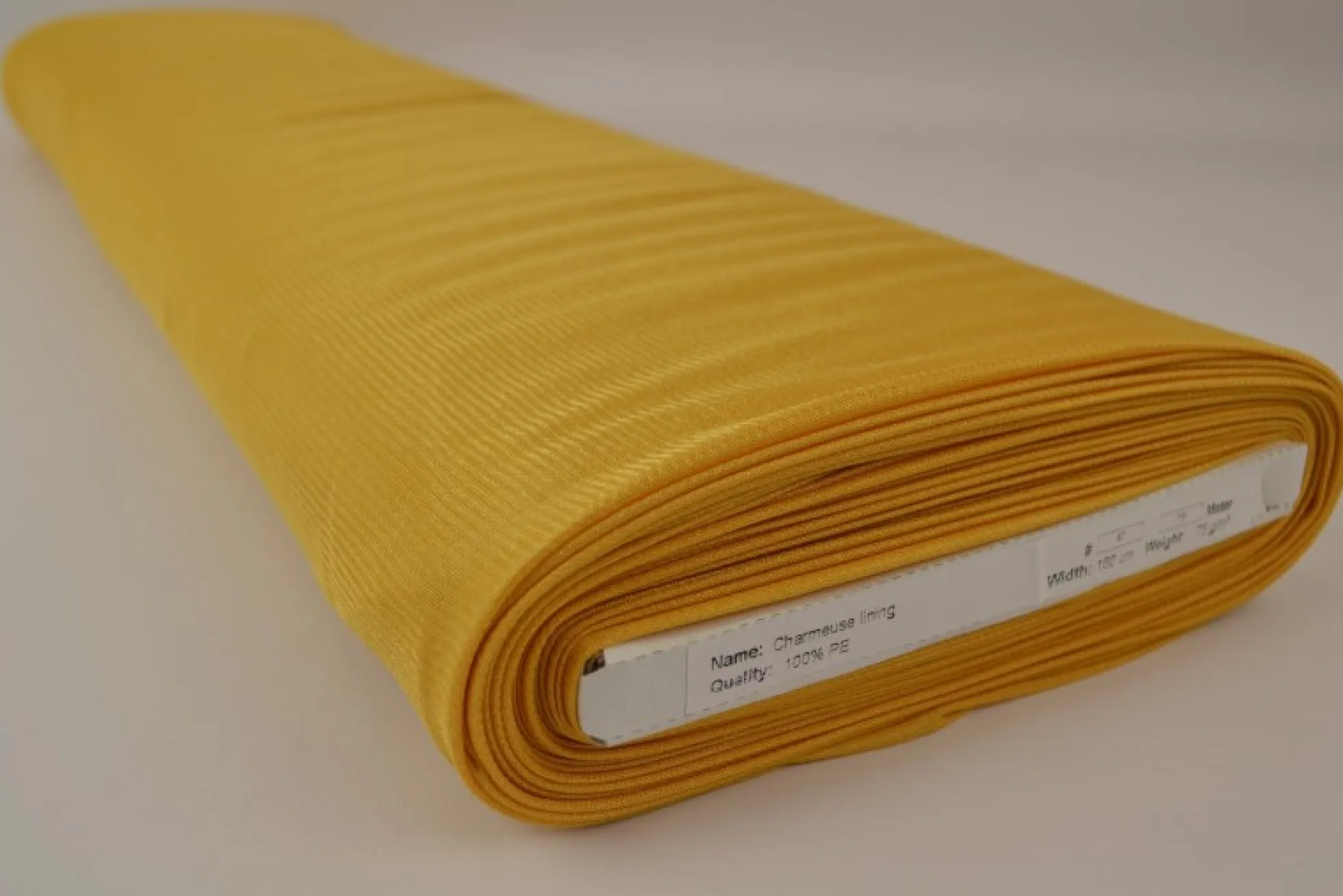 Tricot voering / Charmeuse: Okergeel